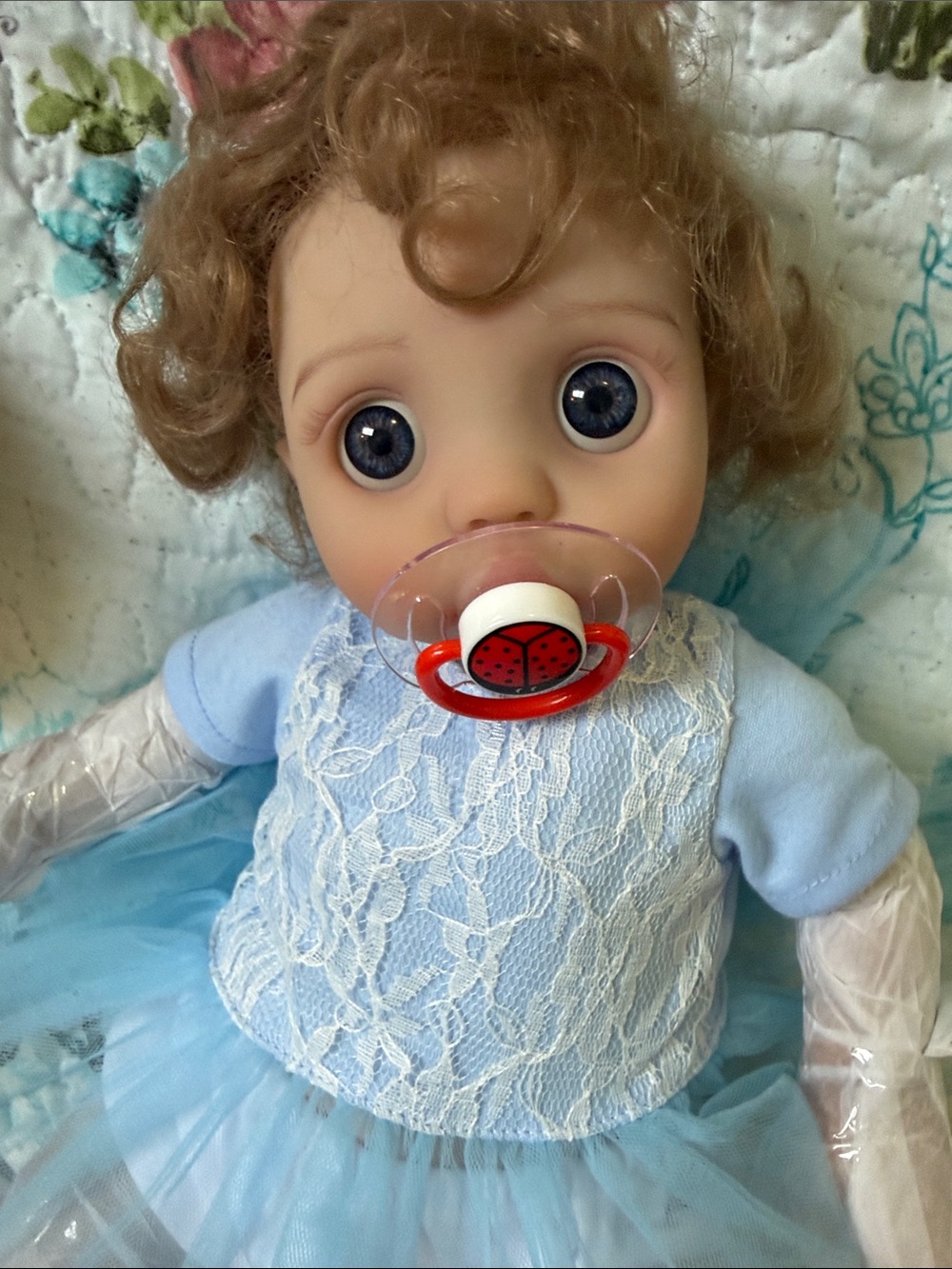 NWT..Reborn Blue-Eyed Baby Doll with Curly Hair. Adorable..
